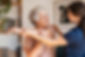 senior-woman-with-trainer-exercising-at-home-2UCM4L9-min.jpg