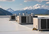 hvac system on airport roof with mountains in the background.jpg