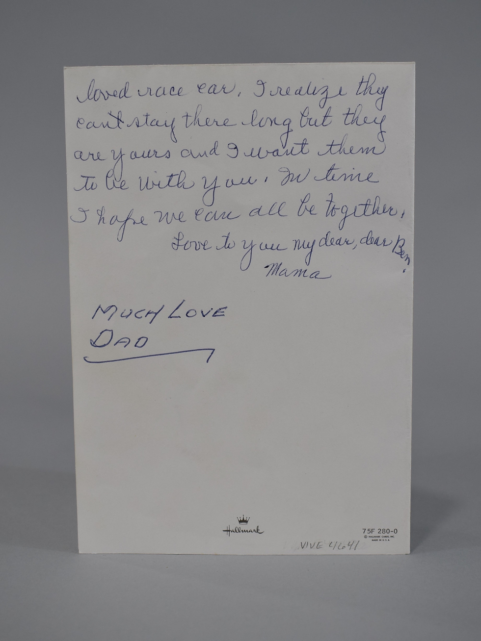 A handwritten Hallmark card left at a memorial in 1984 for Bernard Arthur McDermott III, a soldier killed in action in 1969, with a message from his parents.