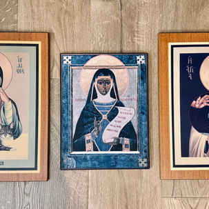 Three framed icon-style portraits of Julian of Norwich on a wood floor, with calm faces and the text Julian of Norwich.