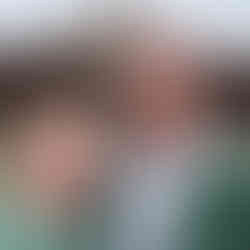 two people standing in front of Administration building