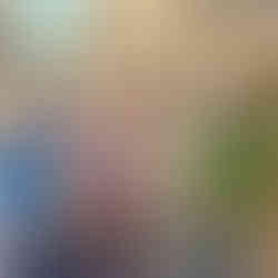 four people standing in a row in a meeting room