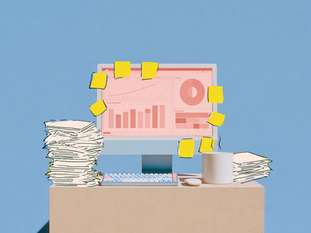 A computer covered with sticky notes