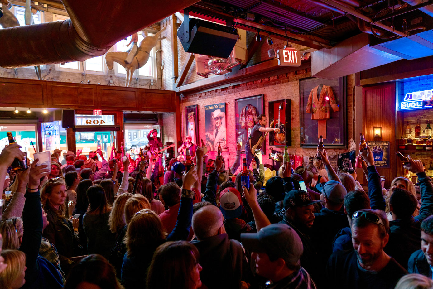 Crowd enjoying a live band on stage at Nudie’s Honky Tonk in Nashville