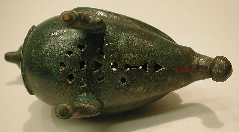 12th Century. Iran. Brass; cast, pierced, chased, engraved. Untranslated inscription in Kufic. H. 6 15/16 in. (17.6 cm) L. 5 3/16 in. (13.2 cm) W. 3 3/8 in. (8.6 cm). Accession no. 1972.87.