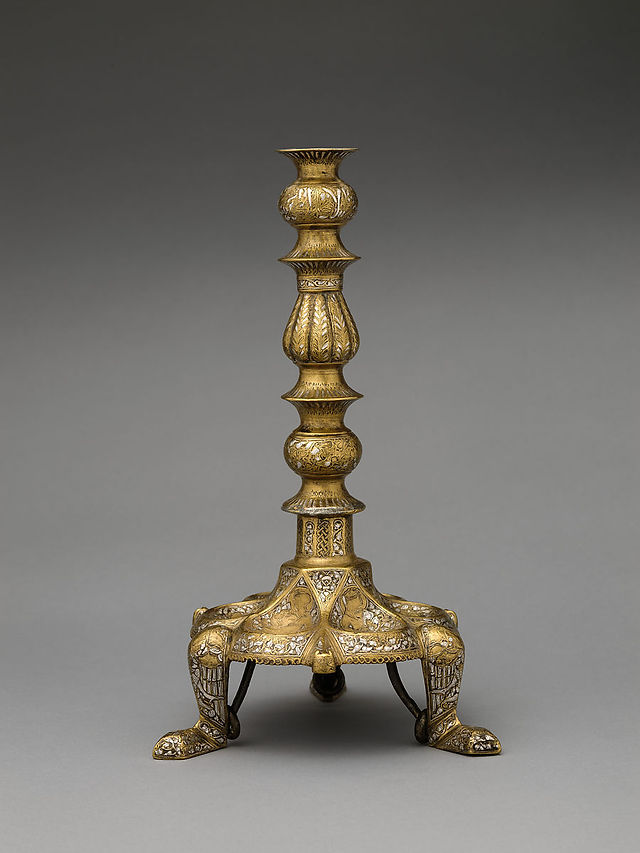1st half of 14th Century. Attributed to Egypt. Brass; cast, engraved, incised, and inlaid with silver. Inscription in Arabic: Of what was made to order for our Lord, the Illustrious, the Well-served Sharaf al-Din `Abd al-Rahman. H. 12 5/8 in. (32 cm) Diam. 7 1/2 in. (19.1 cm). Accession no.: 91.1.572.