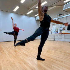 Advanced adult ballet technique class in dance studio