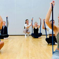 Adults strength and conditioning class for adult dancers exercising.