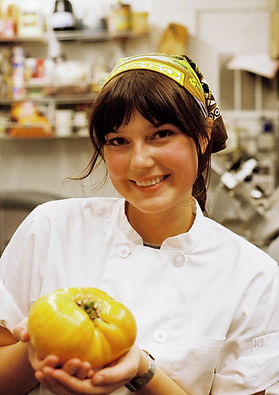 young female chef cooking for supper club