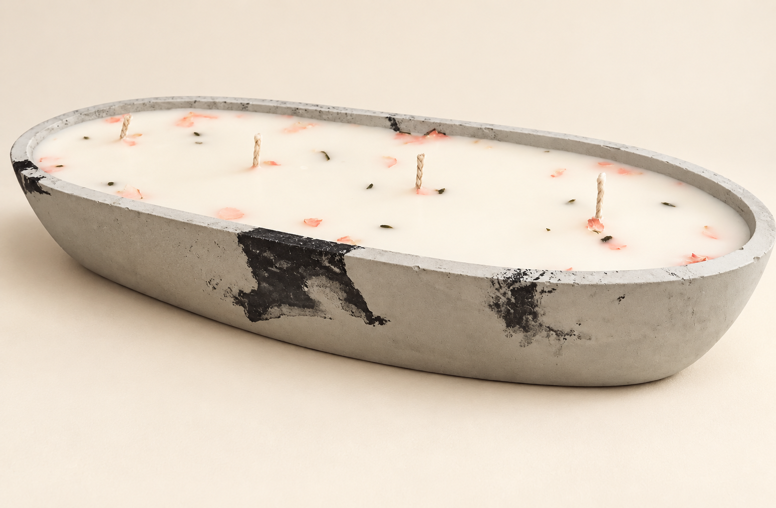 Long oval gray and black concrete candle with four cotton wicks