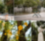 Empty park with a metal chair by a pond, flowers, and a statue surrounded by trees. Warm colors and a peaceful atmosphere.