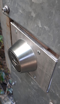 a high security deadbolt on a gate