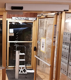 automatic door with an active infrared sensor to release maglock