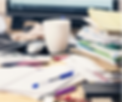 Messy desk with lots of papers