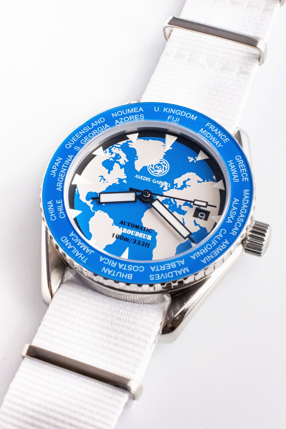 Thumbnail: Avedis Gabriel "Baroudeur" watch with blue rotating bezel and world map dial and white NATO strap