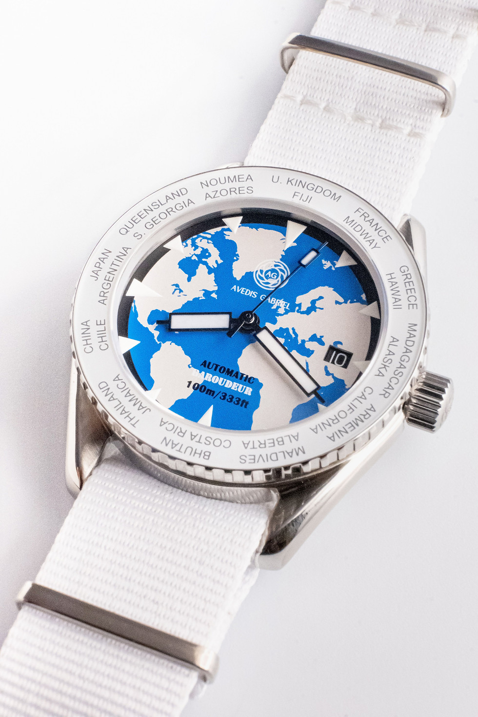 Thumbnail: Avedis Gabriel "Baroudeur" watch with white rotating bezel and world map dial and white NATO strap