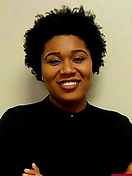 A woman wearing a black polo shirt and earrings, smiling.