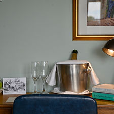 Hotel room desk with lamp and champagne