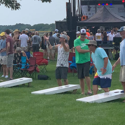 People playing cornhole at WaunaBoom on a nice day