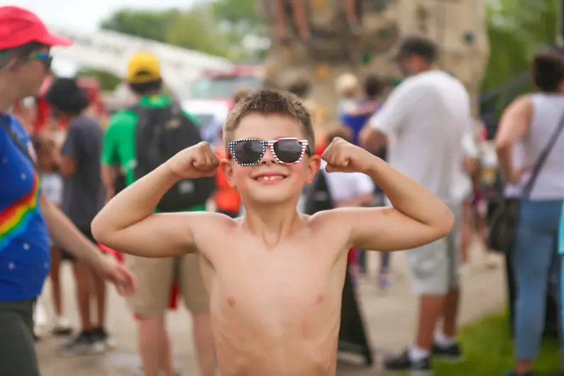 WaunaBoom Boy Flexing with Sun Glasses.webp