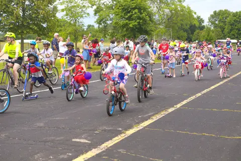 Children with decorated bikes participating in the WaunaBoom bike parade