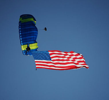 WaunaBoom Parachute Team descends over Ripp Park