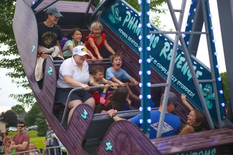 Group of people riding the Phantom’s Revenge pirate ship at WaunaBoom