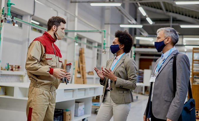 industrial-worker-talking-company-managers-production-facility-covid19-pandemic.jpg
