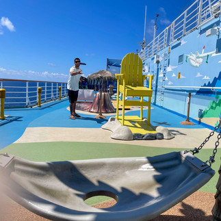 men playing corn hole