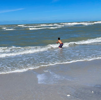 Boy jumping inside water at Cayo Costa state park
