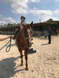Girl riding horse