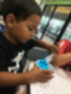 Boy eating ice cream at Love Boat Ice cream in Sanibel island Florida