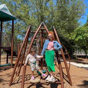 Girl and woman holding hand at Manatee Park Playground