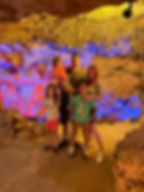 Family posing together inside Florida Caverns during the guided tour.