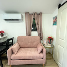 Living area in The Pink Casita with blush loveseat and soft pink accents.