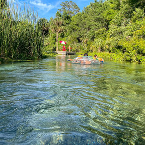 two people in a tube floating down the rock springs at Kelly Park in Apopka.