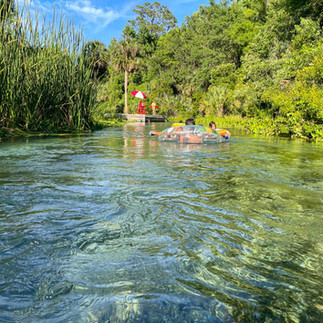 tubing down the crystal clear waters of rock springs