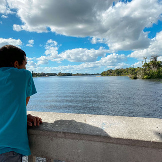 Boy looking out at the river