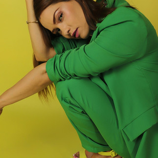 Pose idea squatting down in green suit