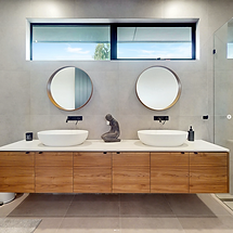 Double vanity sinks installation in full bathroom renovation.