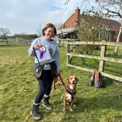 a lady stood with her labrador cross in east Yorkshire showing off her rosette for the shootingsky awards