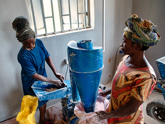 Women operating a Farm Warehouse hammer mill in Benue State, Nigeria