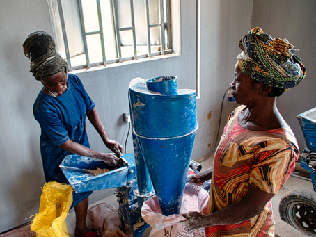 Women operating a Farm Warehouse hammer mill in Benue State, Nigeria