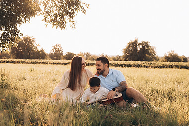 Family on a field during sunset in Basel
