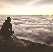 Man looking over clouds_edited.jpg
