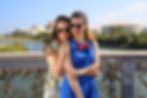 Two female friends striking a pose, adorned with stylish sunglasses.