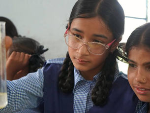 Hands-on learning environment with children exploring educational activities through experiments, observation, and interactive experiences.