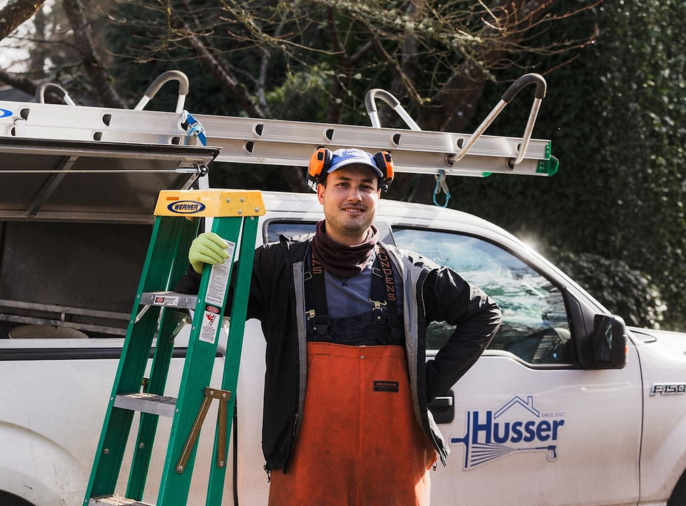 Owner of Husser Window and Gutter Cleaning standing in front of his truck in Mercer Island, WA