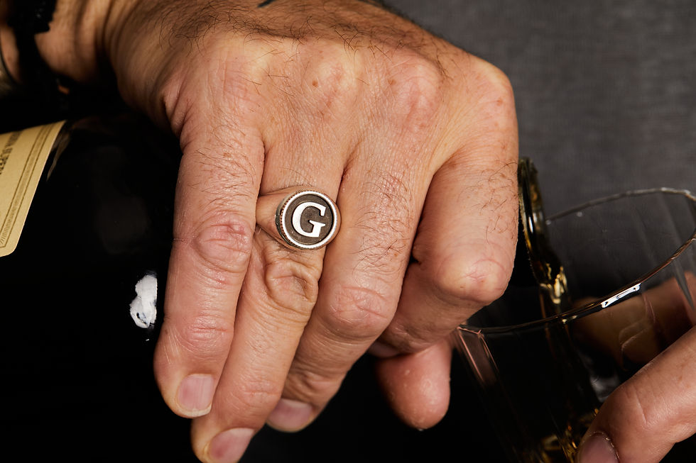 Thumbnail: Custom sterling silver signet ring with personalized initial engraved on a round face.