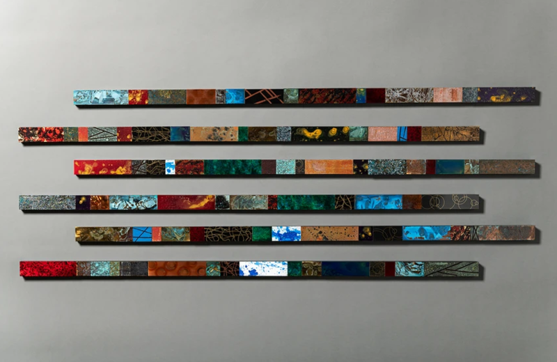 Horizontal metal wall sculptures with colorful panels by metal artist Cassidy Watt.